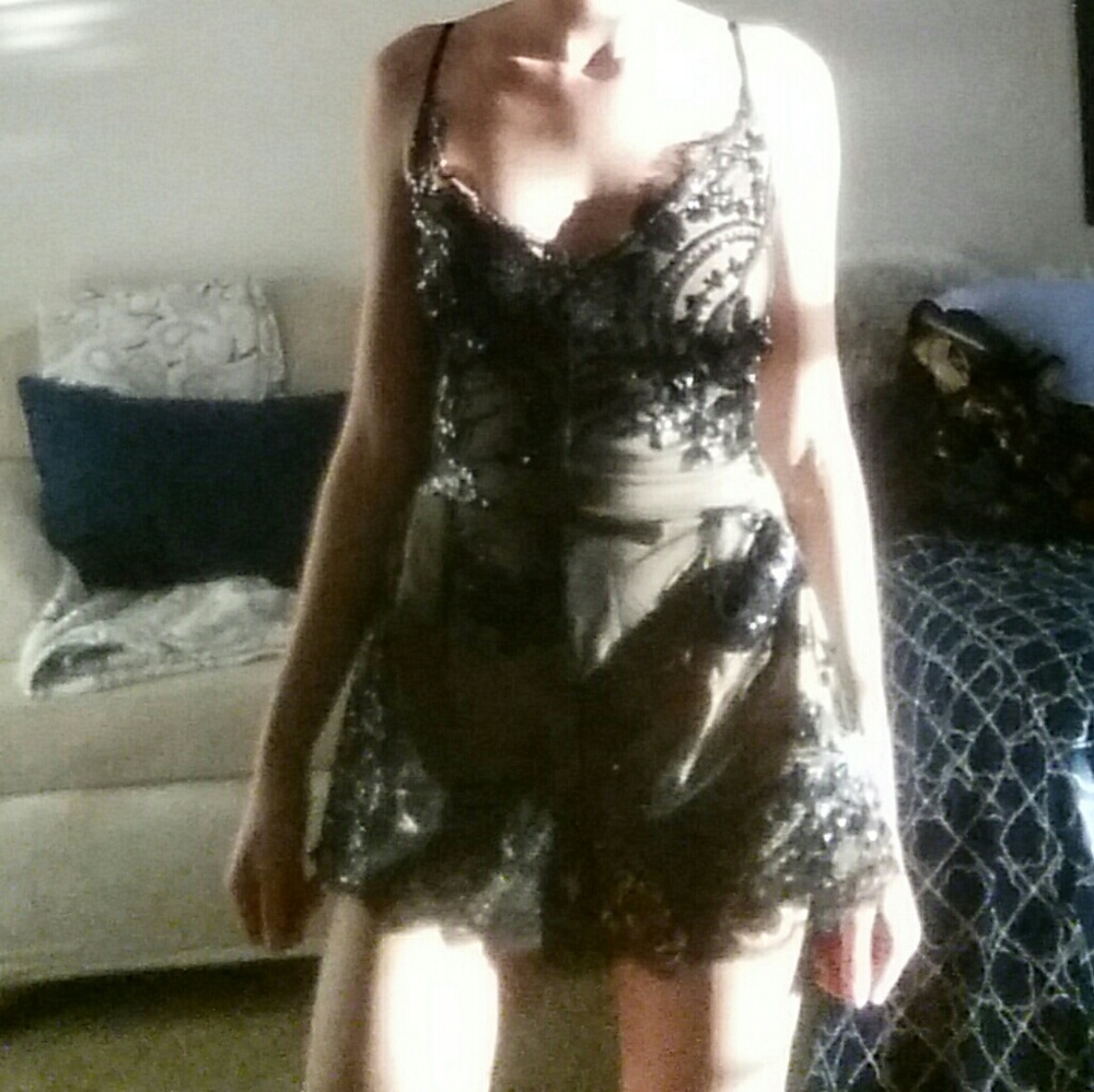 Black and tan sequined lace romper.
